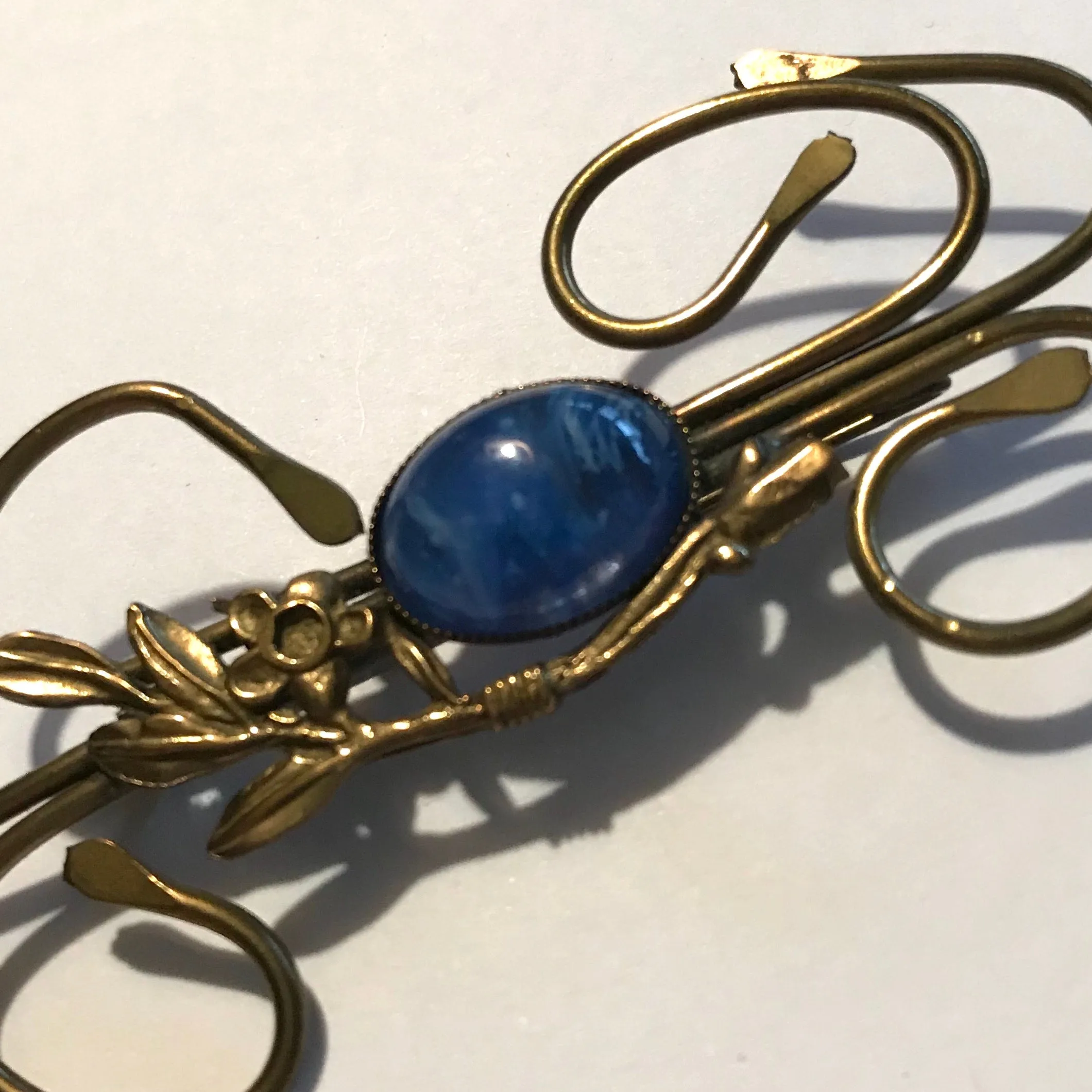 Medusa Inspired Gold Flower and Vine Brooch with Blue Art Glass Center circa 1910s