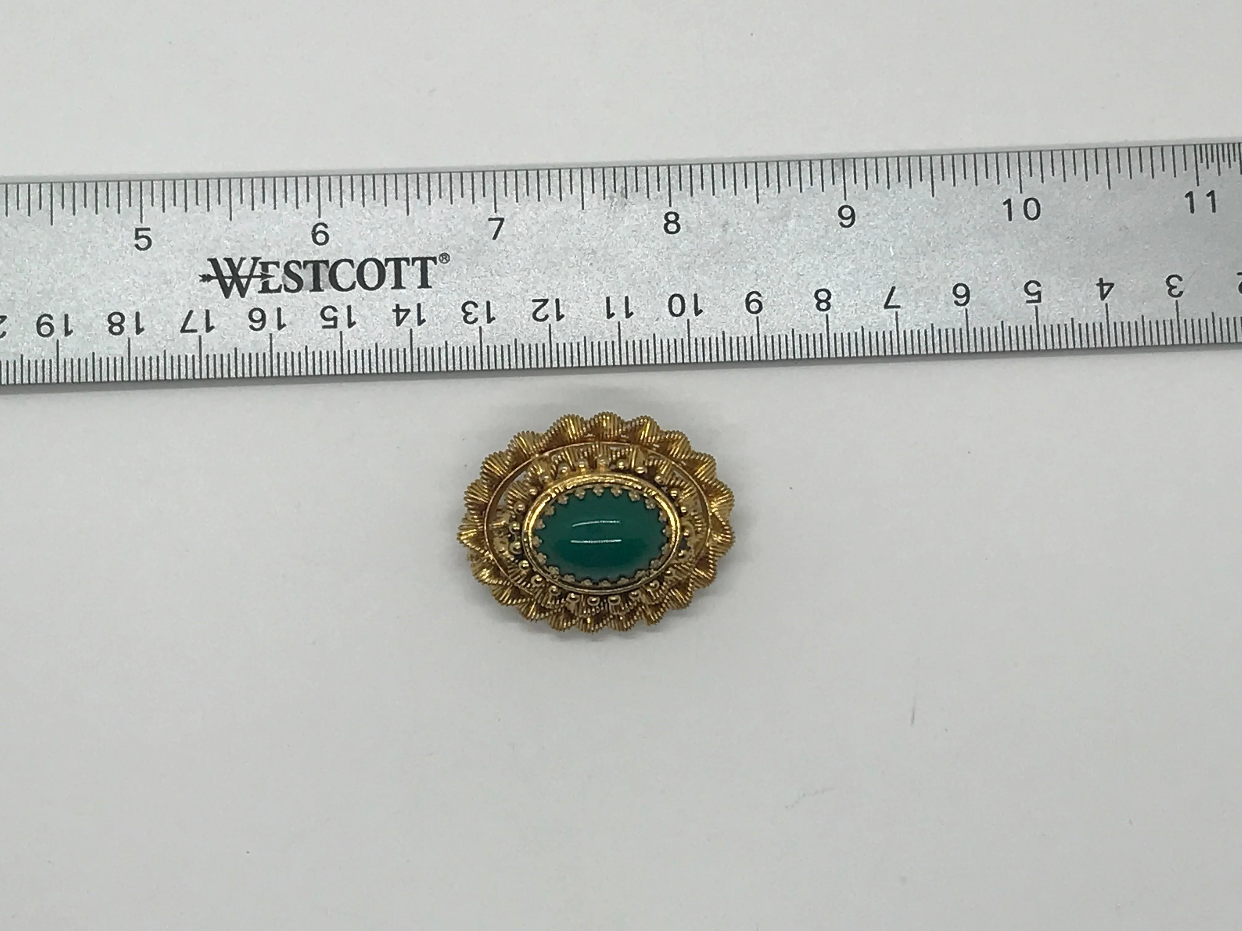 Vintage Green Oval Cabochon Brooch with Textured Setting